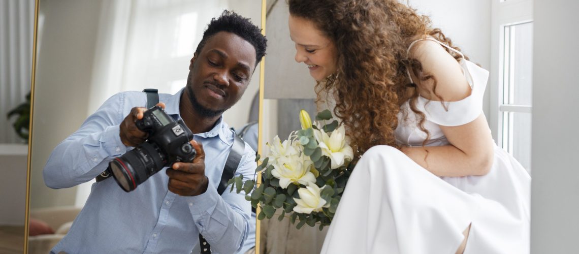 front-view-photographer-holding-camera (1)